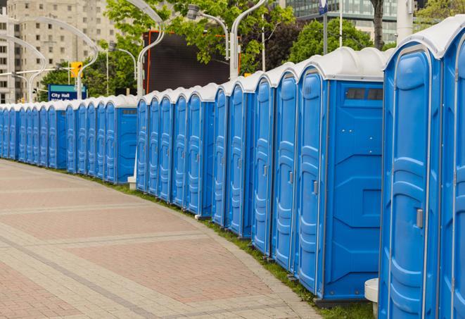 a row of portable restrooms at a fairground, offering visitors a clean and hassle-free experience in Cleveland